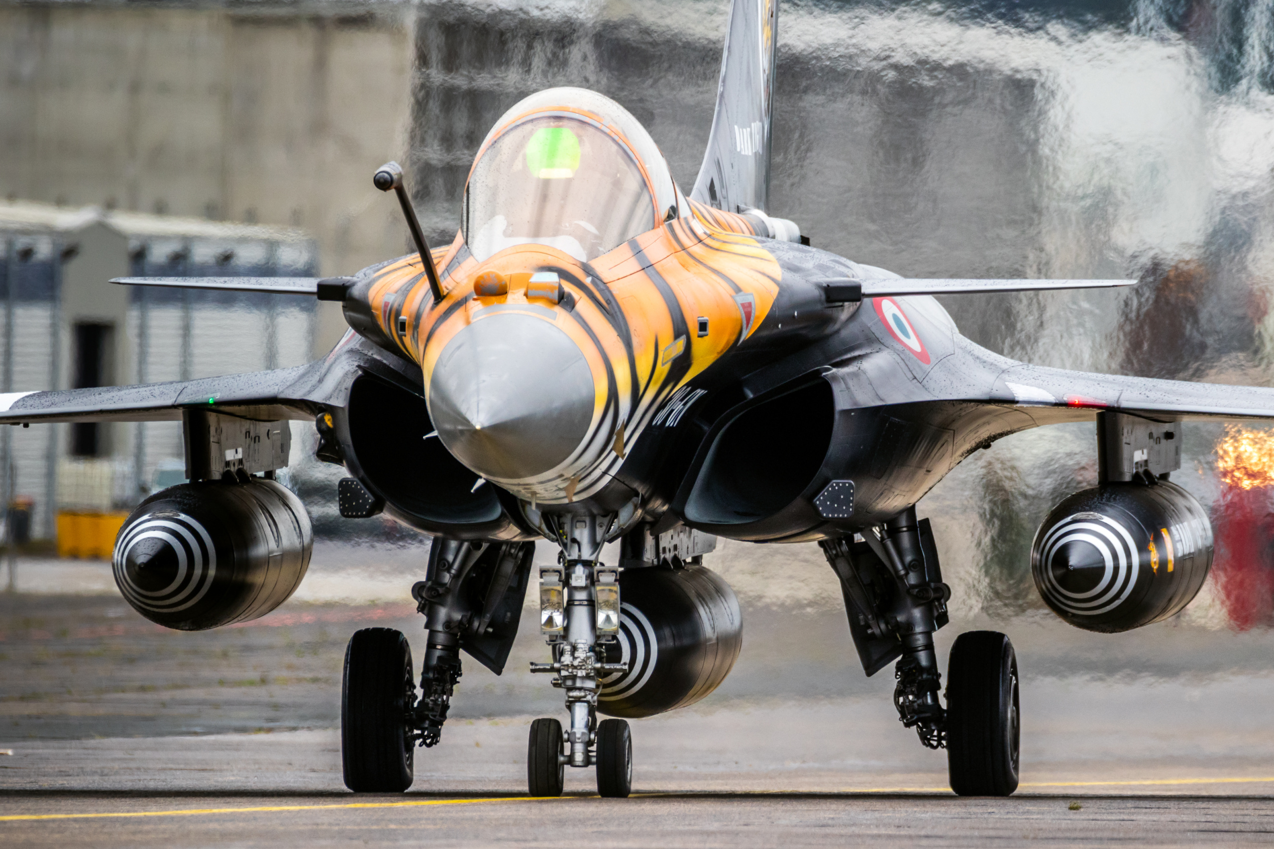 MONT-DE-MARSAN, FRANCE - MAY 17, 2019: Special painted French Air Force Dassault Rafale fighter jet plane taxiing to the runway during the NATO Tigermeet.